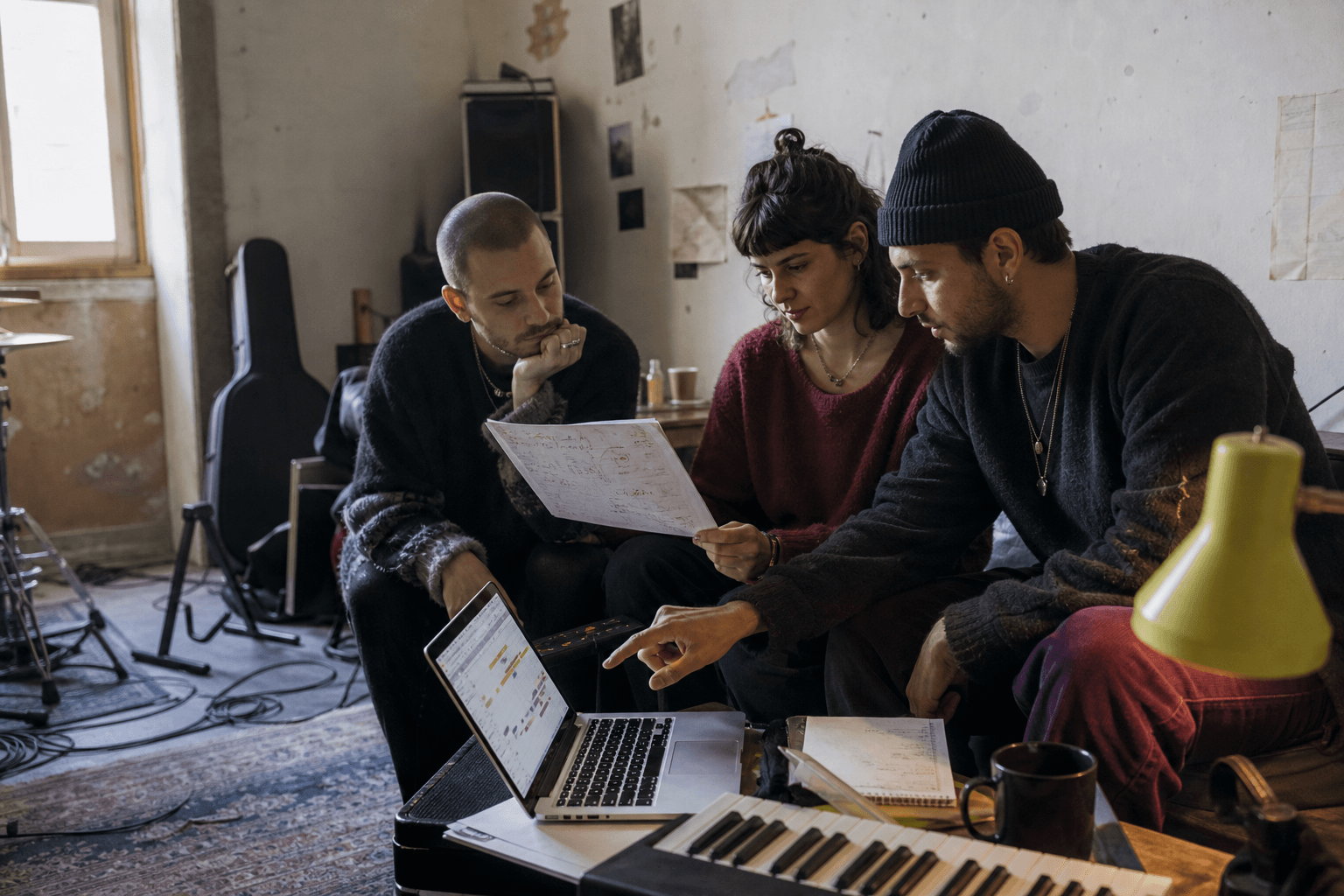Independent artists planning a release campaign together in a rehearsal room